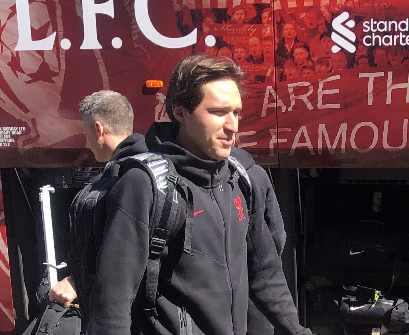Chiesa getting off of the Liverpool team bus.