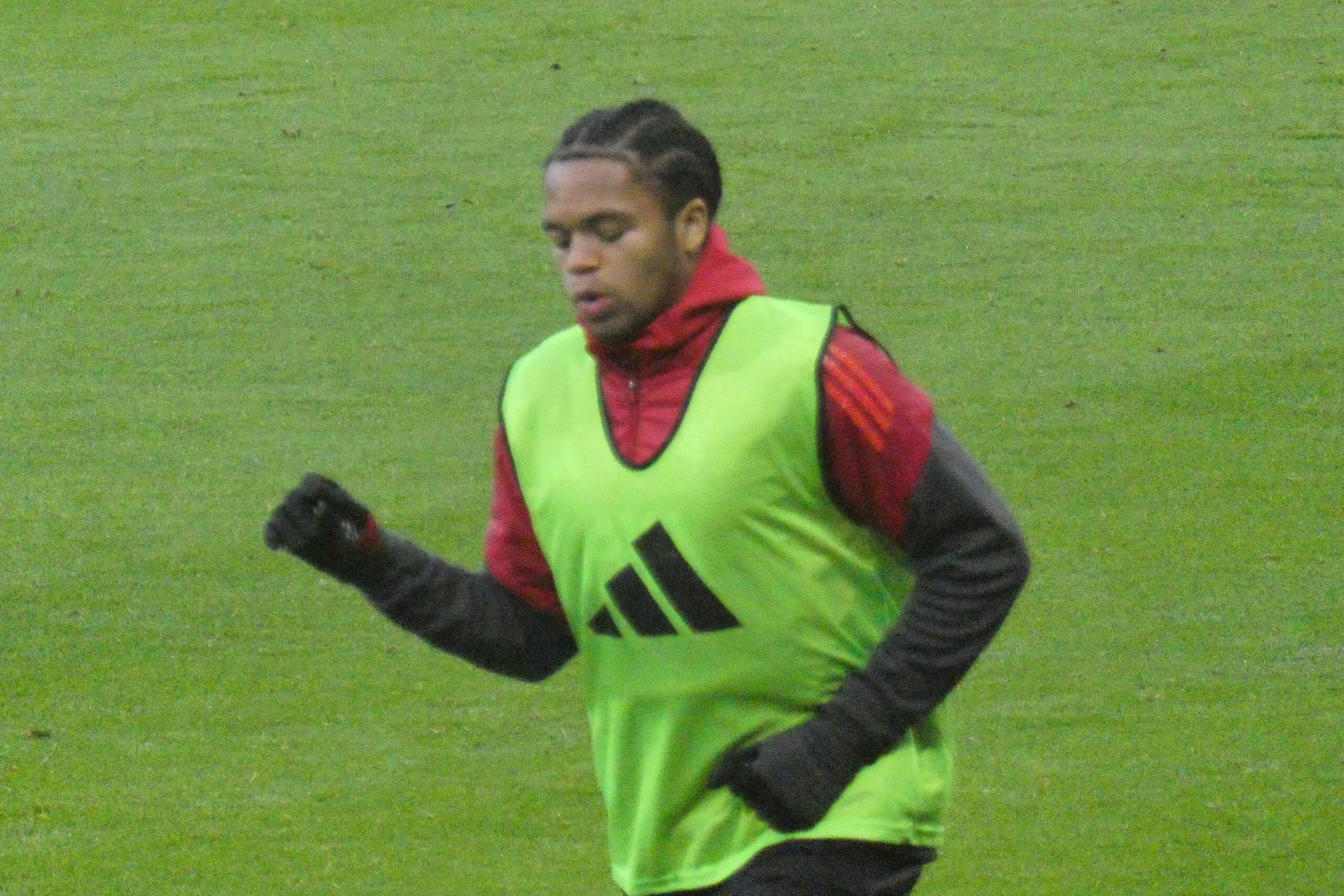 Rio Ngumoha warming up for Liverpool